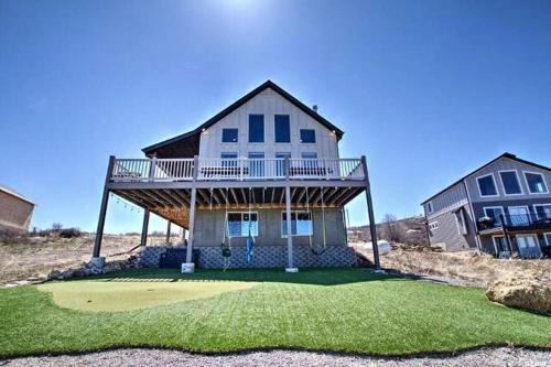 Harbor Village House | Putting green with hot tub, swings and spectacular views