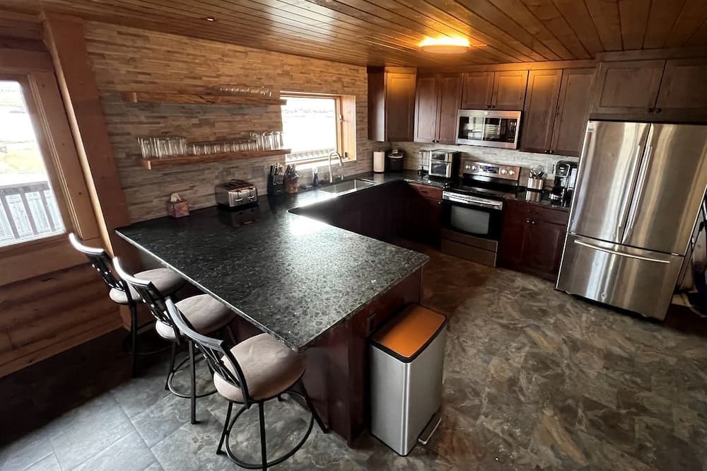 Ennis House | Scenic Vacation Home with Wrap-Around Deck Overlooking Ennis Lake near McAllister, Montana