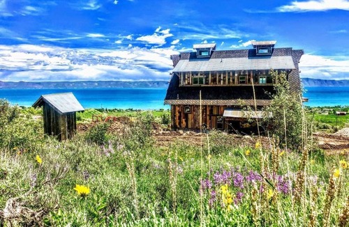 Fish Haven House | Artistry barn where the building is a work of reclaimed art with amazing views