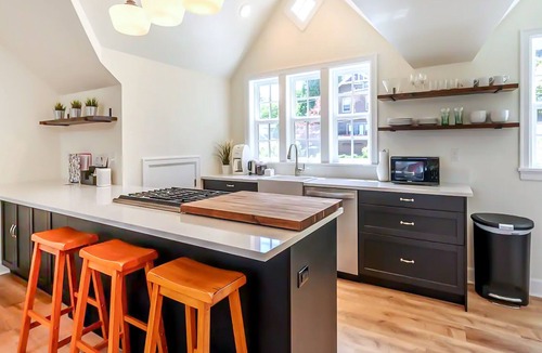 Uptown Apartment | Central city apartment with mountain-views, fireplace, & private washer/dryer