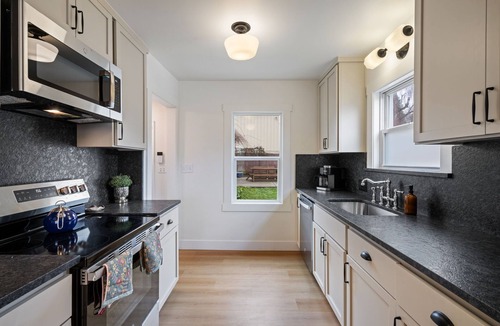 Camas House | Charming Camas home with 3 bedrooms and a shared bath, just minutes from downtown. Relax by the fireplace, enjoy a bright living space, and cook in the updated kitchen. A comfortable spot for families or small groups visiting Camas, WA.