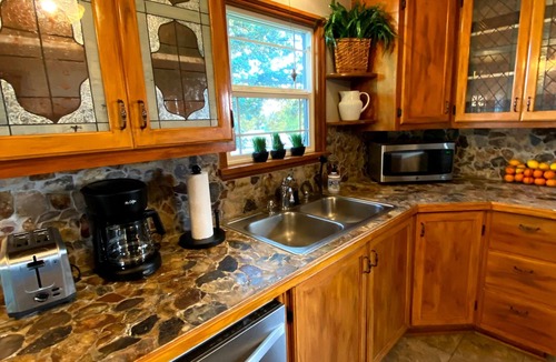 Veterans Park House | Cozy cottage with private backyard. Fire pit, hot tub, bikes, and paddleboards
