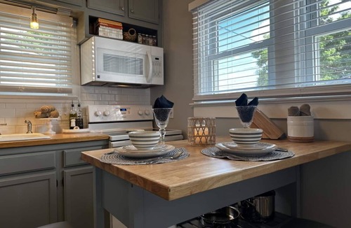 Sheridan House | Experience our elegantly renovated craftsman bungalow in Sheridan, a charming retreat just a two-block walk from historic downtown. Blending period character with modern comforts, this home comfortably fits 6 guests.