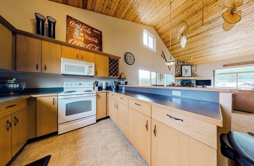 Big Sky Condo | Mountain-view gem with fireplace, garage, washer/dryer & alfresco dining