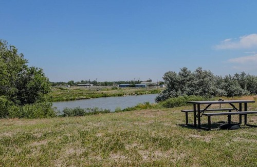 Casper House | Relax at this riverfront getaway with direct access to fishing, kayaking, and peaceful waterfront views. End your day around the fire pit, grill dinner outdoors, and enjoy a quiet escape surrounded by nature.