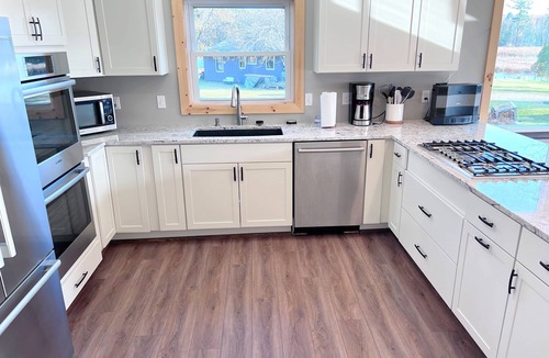 Alanson Cabin | Spacious Downtown Alanson Riverfront Cabin with Amenities- 10-12 guests