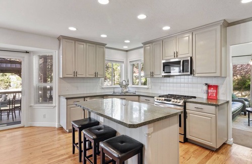 Draper House | Spend your days exploring the mountains, come home and soak in the hot tub, grill on the deck, reconnect with family and friends in the thoughtfully designed comfortable retreat with both intimate and large gathering spaces.