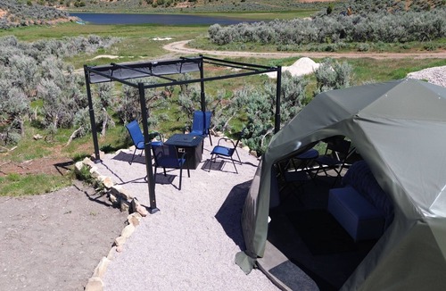 Laketown RV Rental | Unplug and unwind in our secluded off-grid glamping dome, nestled by a private lake. Enjoy the peace and quiet with all the comforts of home