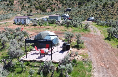 Laketown RV Rental | Unplug and unwind in our secluded off-grid glamping dome, nestled by a private lake. Enjoy the peace and quiet with all the comforts of home.