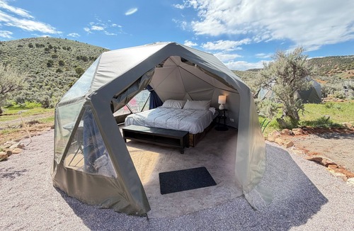 Laketown RV Rental | Unplug and unwind in our secluded off-grid glamping dome, nestled by a private lake. Enjoy the peace and quiet with all the comforts of home.