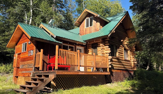 Cozy cabin bordering forest service trails. Perfect escape on 10 acres of forest in Bigfork