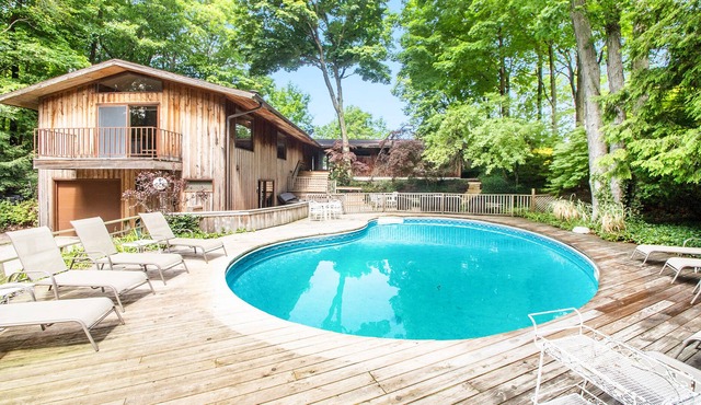Dog-friendly lakefront house with private hot tub, outdoor pool, beach, WiFi in Harbert