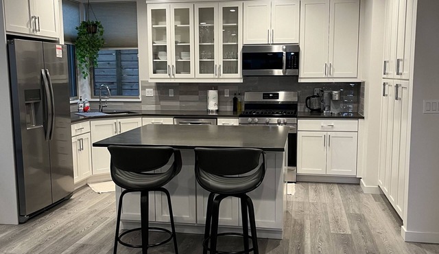 New centrally located townhouse with rooftop deck. Walk to restaurants and shops in Seattle