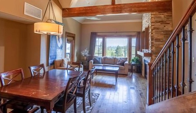 Private Balcony | Stunning Wood Accented Living Room | Walk-in Shower and Deep Soaker Tub in Donnelly