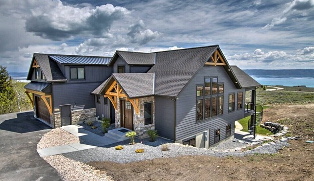 Spacious mountain home with lake views, large decks, bunk rooms, and resort amenities