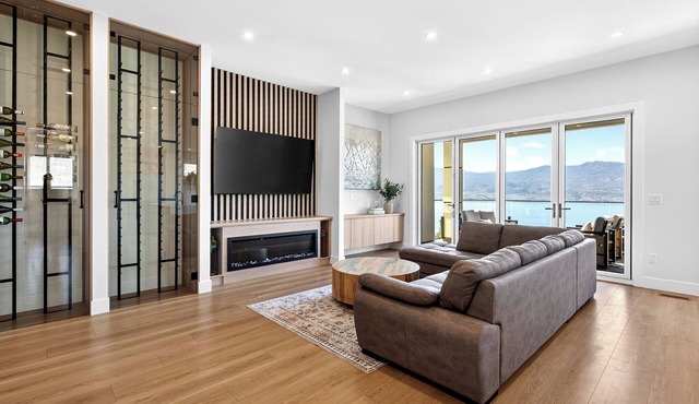 Stay in an elegant 4 bedroom estate in the prestigious Lakeview Heights. Featuring 2 king beds, 2 queen beds, sofa bed, 5 bathrooms, hot tub, movie room & patio with lake & mountain views. Close to wineries, beaches & downtown Kelowna. in West Kelowna