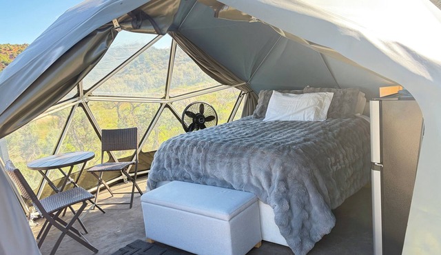 Unplug and unwind in our secluded off-grid glamping dome, nestled by a private lake. Enjoy the peace and quiet with all the comforts of home
