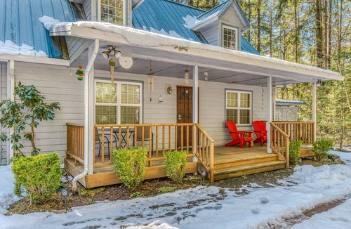 Zigzag House | Cozy home with river access, private hot tub, wood stove, fireplace, & W/D