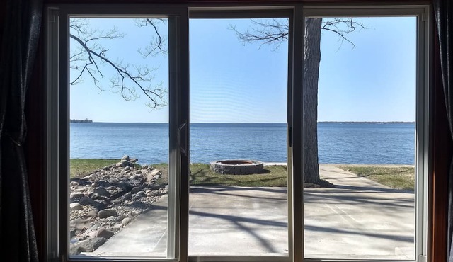 Private Lakefront Cottage with 90' of sandy East Bay frontage on Houghton Lake in Prudenville